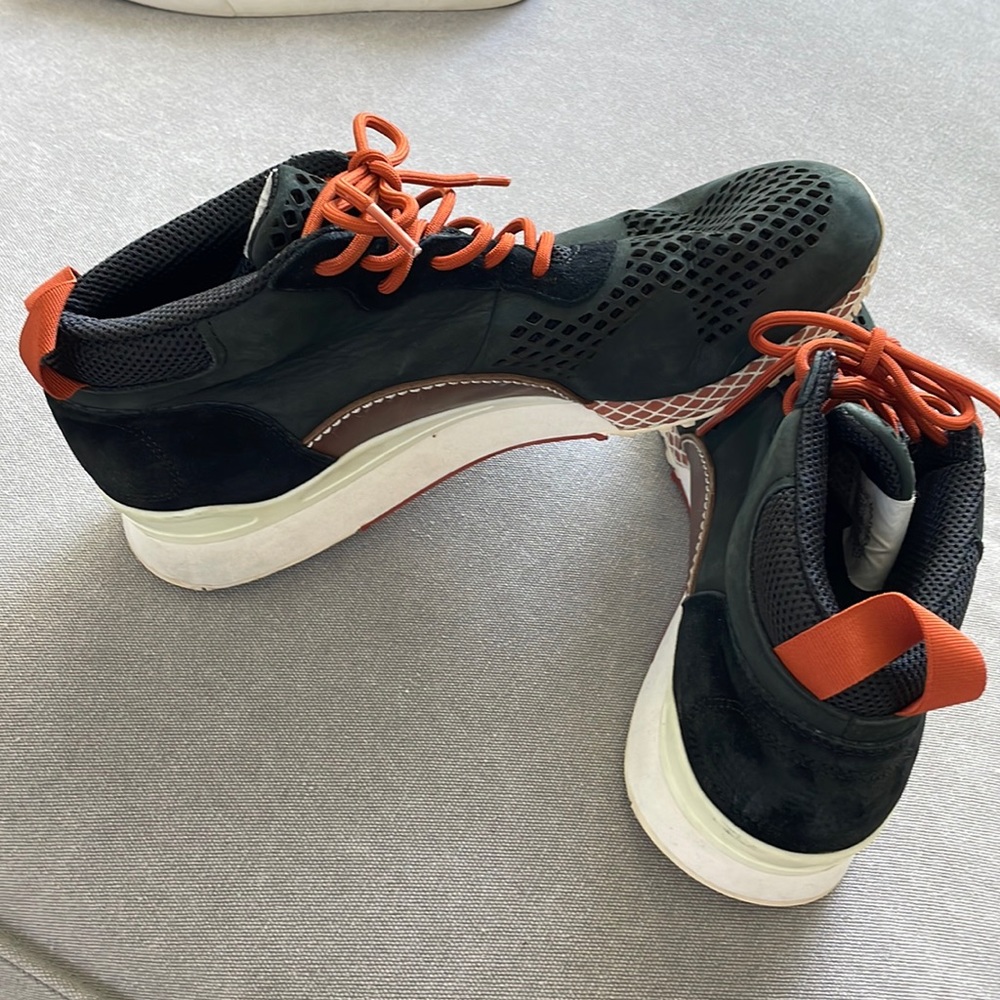 Black adidas with orange.